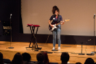 Isabelle Caneda sings and plays electric guitar.