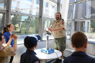 Mark Shotwell, an audio engineer at the Center for the Arts and a leader with Cub Scout Pack 286 in Tonawanda, has a hair-raising experience with a Van de Graaff generator in Davis Hall.