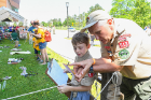 Aaron Belanger, 10, from Cub Scout Pack 272 in Cheektowaga, learns about best camping practices from Fred Thornley, East Aurora Pack 513.