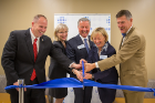 The ceremonial ribbon-cutting was a team effort, with state Sen. Tim Kennedy (far left) joining Renee Fillip, Michael Cain, Anne Curtis and Kevin Gibbons in doing the honors. 