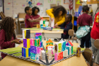 Students from Alina Clark's class at PS 53 Community Park school in Buffalo show off the architectural models they created this November.