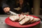 A diner selects a piece of peppermint bark.