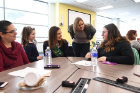 Lauren Kuwik (third from left), clinical instructor in the Department of Medicine, talks with Brianna Morrissey (right).