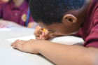 Xavier Jones, 9, focuses as he works on his drawing.