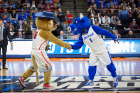 Victor E. Bull and Arizona mascot Wilbur Wildcat shake hands before a "dance-off" during a TV timeout. Victor soundly defeated Wilbur in the dance-off.