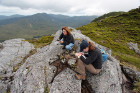 From left: biologist Charlotte Lindqvist and geology PhD candidate Alia Lesnek work at Dall Island. Photo: Jason Briner