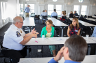 Gregory Gill (left), deputy commissioner for Erie County's Department of Homeland Security and Emergency Services, and Gale Burstein (center), the county's health commissioner, led a breakout group on health and emergency services.