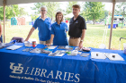 The evening's theme was “Experience UB Night,” a chance for the community to learn what UB and the University District have to offer. Here, representatives from the UB Libraries staff an information table.