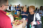 Tonawanda-based Boulevard Produce shows off some of its apples in the Pride of New York tent outside the Student Union. The Pride of New York program showcases locally grown and made products.