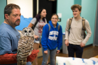 This owl from the Association for Wild Animal Rehabilitation (AWARE) attracts some interest from students.