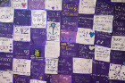 Messages of support form a quilt displayed during the Walk with Us event.