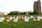 The signs are displayed on the Special Events Field across Putnam Way from the Student Union.