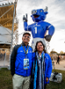 President Satish K. Tripathi and his wife, Kamlesh, pose with a giant Victor E. Bull balloon near the tailgate tent before the game. 