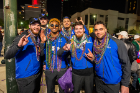 It's not a Mardi Gras parade without beads, and these UB football players have joined in the fun.