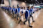 The Thunder of the East marching band enters the Mobile Convention Center to perform at the Dollar General Bowl Mayor's Luncheon.