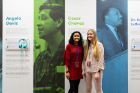 Presidential Scholars Sushmita Patil (left) and Sam Nelson stand in front of the Cesar Chavez panel. The women conducted research on Chavez, who was one of five powerful figures in the civil rights and political movements of the 1960-'70s featured in the exhibit.