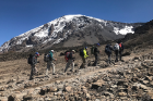 Kilimanjaro forms the backdrop as the group makes its way to the High Camp.