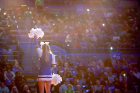 A cheerleader performs during the pre-game introductions.