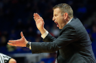 Coach Nate Oats reacts to a call.