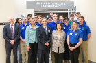 A group of students and faculty from the School of Engineering and Applied Sciences poses with France Córdova outside the UB Nanosatellite Laboratory.