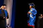Despina Stratigakos (left), vice provost for inclusive excellence, greets an ALANA graduate. Photo: Meredith Forrest Kulwicki