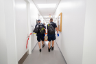 Members of the Buffalo Fire Department walk through the halls of the Jacobs School.