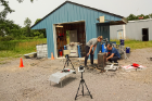 In the morning, DiemKaye, left, and Sonder check the experiment’s water injection system. This task is among the prep work that the researchers perform while waiting for the rock to melt, which takes about 4 hours. Photo: Charlotte Hsu