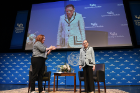 Justice Ruth Bader Ginsburg is greeted with applause as she sits down for a Q&A with School of Law Dean Aviva Abramovsky (left). Photo: Nancy J. Parisi