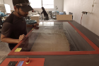 UB architecture alumnus Randy Fernando inspects fabrication work on “Ocean Cube.”