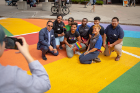 Kevin Ahuna (left), director of the Intercultural and Diversity Center, poses for a photo with the center's staff and student Diversity Advocates.