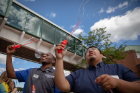 Students Ousman Kaba and Adrian Vega Bautista blow bubbles.