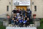 UB student volunteers pose with members of the Macedonia Baptist Church on East North Street. The UB crew was tasked with moving items from a former classroom into storage.