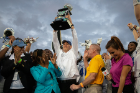 Bulls head coach Lance Leipold holds the Prime Minister's Trophy. Photo: Meredith Forrest Kulwicki