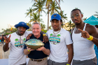 And the winner of the dance contest: UB! Posing with the golden football trophy are (from left) cornerback Larry Robbins; Craig Johnson, mayor of Elk Grove Village, Illinois, the sponsor of the Makers Wanted Bahamas Bowl; wide receiver Trevor Wilson and linebacker Max Michel. Photo: Meredith Forrest Kulwicki