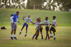 Safety Dawun Hylton joins some young teammates at the youth football clinic. Photo: Meredith Forrest Kulwicki