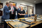 Irish Sen. Billy Lawless (second from left) and his wife, Kate, look at pieces from UB's renowned James Joyce Collection. With the Lawlesses are James Maynard (far left), curator of the Poetry Collection and interim coordinator of the Rare & Special Books Collection, and state Sen. Tim Kennedy (background).