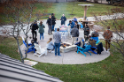Participants gather around a fire pit near the Student Union.