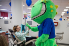 A patient gets a high-five and a reassuring smile.