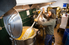 Nick Cappello stirs a vat of grain used to make the high-test alcohol. 