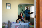 Amber and Darius Melvin, assistant director for admissions for the School of Law and academic adviser with the Honors College, respectively, with their 11-month-old son Mateo, mainly work in the living and dining areas of their North Buffalo home. Their last day on campus was March 16.