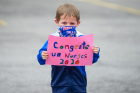 Clinical Assistant Professor Joann Sands' son, Matthew, made a special sign for the graduates. 