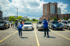 Tess Morrissey (left) and Dillon Steed, both from the Office of Government and Community Relations, give the thumbs-up as the celebration gets underway.