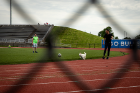 Mohsen Hashel (right in black clothing), a senior studying mechanical and aerospace engineering, plays soccer with friends and his new puppy, Apollo. Hashel says he likes coming to the field because it is fenced in and Apollo can have room to run.