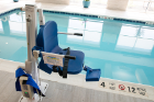 A pool lift chair to help people into the pool.
