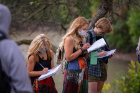 From left: environmental studies majors Celia Phillips, Natalie Harvey and Isabel Luthringer take notes.