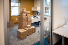 Boxes wait to be unpacked in the office of Amy Myszka, director, Benefits and Work Life Balance. 