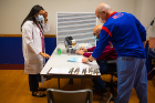 Chief resident physician Aakanksha Khanna checks in for her second dose of the COVID-19 vaccine.