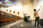 Neel Rao teaches an economics class in Knox Hall.