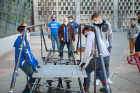 John Gast (brown coat), industry adviser in the Department of Civil, Structural and Environmental Engineering, watches intently as the load test team prepares for the various load tests.
