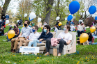 The event was carefully organized to ensure a safe celebration, with masked guests seated on the lawn in spray-painted circles spaced six feet apart, and “roommate pods” grouped together.